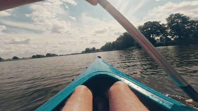 Man Paddles A Canoe On A Lake, Viewed From A First-Person Perspective (Fpv)