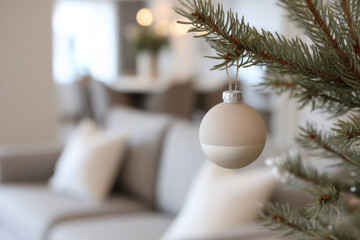 minimalist christmas tree adorned with simple decorations and single striking accent