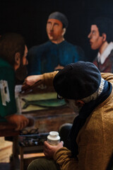 Two Georgian male artists working in their Tbilisi studio. Painting, sketching, interacting with visitors. Candid portraits of creative work and expression