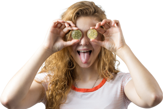 Young red-haired curly girl over white background holding piggy bank and rejoices gesturing. The concept of reliability of cash investments and insurance. Girl puts in the piggy bank physical Bitcoin - Powered by Adobe