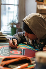 Two Georgian male artists working in their Tbilisi studio. Painting, sketching, interacting with...