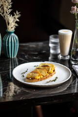 Toast with scrambled egg pear and brie cheese