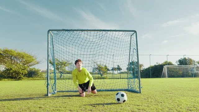 Coach, soccer and shooting with kids on field for penalty kick, sports athlete and fitness. Tournament game, goal and winner with football player on outdoor pitch for club, target and challenge