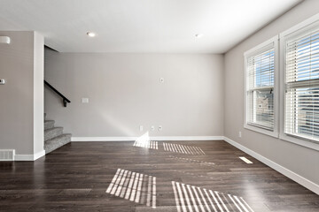 Large open living room with a staircase leading up to the second floor