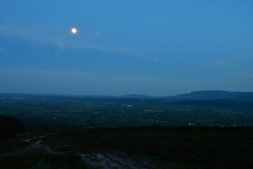 Moon rising in the sky, Slievenamon Mountain, County Tipperary, Ireland