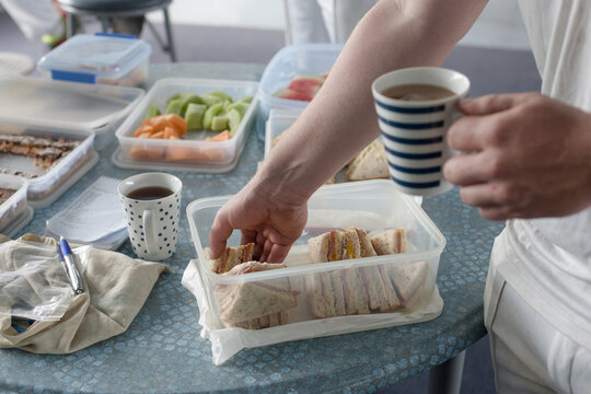 Cricket player having afternoon tea in clubrooms