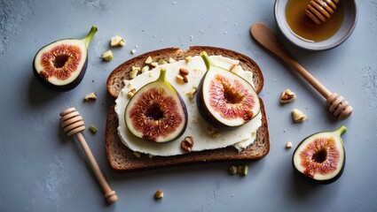 Rye bread toast topped with fresh fig slices, cream cheese, honey, and chopped nuts, perfect for healthy vegetarian breakfast or snack. Top view with blank area.