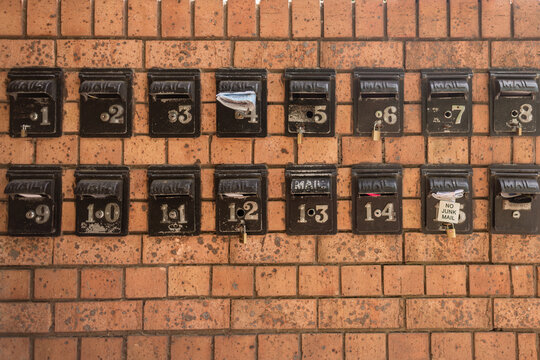 mailboxes in a brick wall
