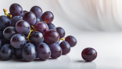 Fototapeta premium Delicious Ripe Black Seedless Grapes in Isolated White Background