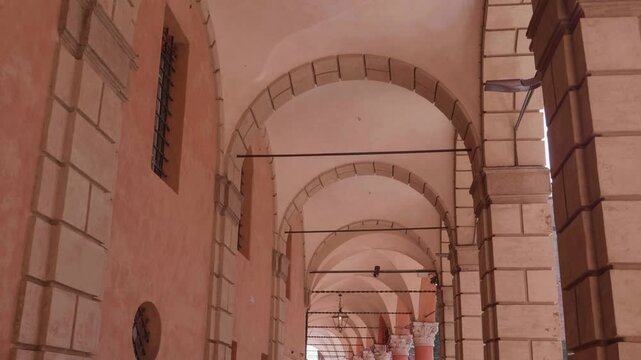 POV point of view walking through famous portico in Bologna Italy