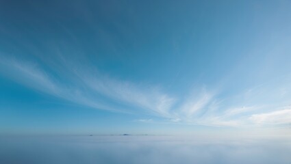 Obraz premium The sun shines brightly over a sky that is blue and cloud-free