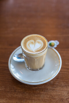 piccolo latte with vintage teaspoon and saucer