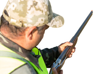 Hunting period, autumn season open. A hunter with a gun in his hands in hunting clothes in the...