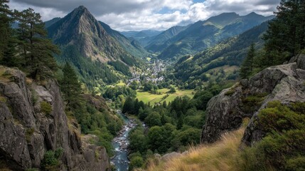 Fototapeta premium Mountain valley with a river and village surrounded by trees under cloudy sky.
