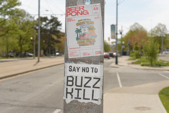 street posters in Toronto (Beer Pong Tournament at Trinity Bellwoods Park) and cryptic "say no to... buzz kill"