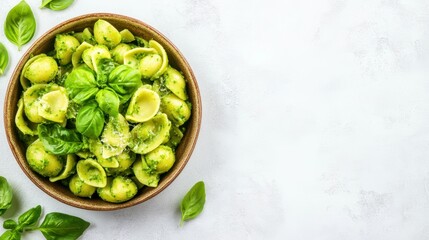 Obraz premium Pesto Pasta Delight: A top-down perspective unveils a rustic wooden bowl brimming with vibrant green pesto pasta, artistically garnished with fresh basil leaves.