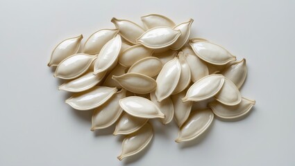 Seeds of Dry Cantaloup Melon or Muskmelon Isolated Against White Background. Large Seeds Similar to Cucumber