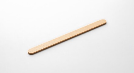 Smooth wooden stirrer rests gently on bright white background.. AI Generated