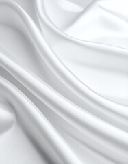 Soft, white fabric drapes elegantly, showcasing smooth textures and gentle folds, creating a serene and calming visual effect