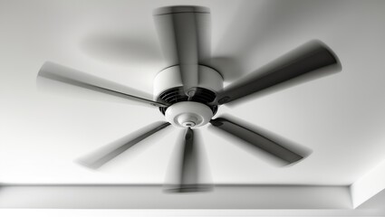Ceiling fan in motion with white blades