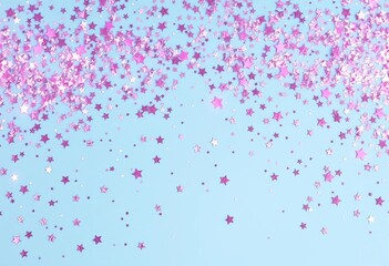 Pastel blue background sprinkled with silver and pink star glitter Festive, sparkly, celebratory, sparkly, abstract