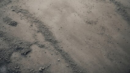 Splashes of heavy rain deposit fine ash sand on concrete surfaces