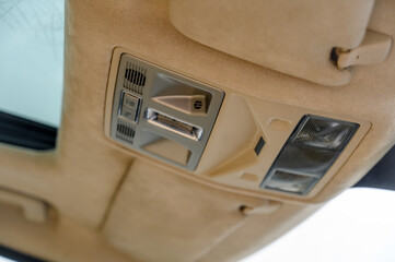 Modern Vehicle Overhead Control Panel Featuring Advanced Safety and Convenience Features