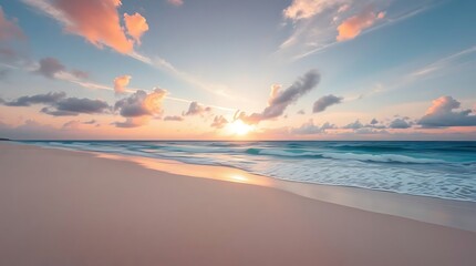 Fototapeta premium Sunrise over a sandy beach with waves and colorful clouds