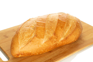 One wheat bun, close-up, isolated on a white background.