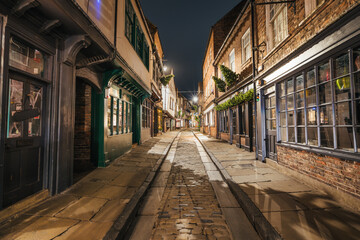 Shambles alley at night in York city. England