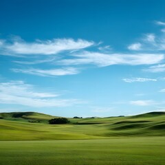 Fototapeta premium Serene Green Landscape with Blue Sky and Fluffy White Clouds
