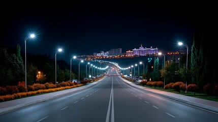 Fototapeta premium Night Highway to Illuminated Cityscape.