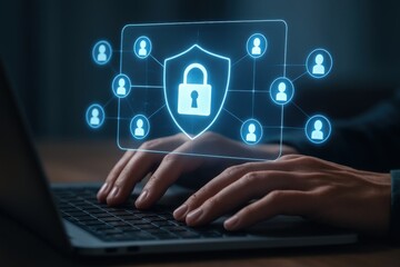 Cyber Security: A pair of hands typing on a laptop, with a glowing digital shield and padlock icon hovering above, signifying protection and security in the digital world.