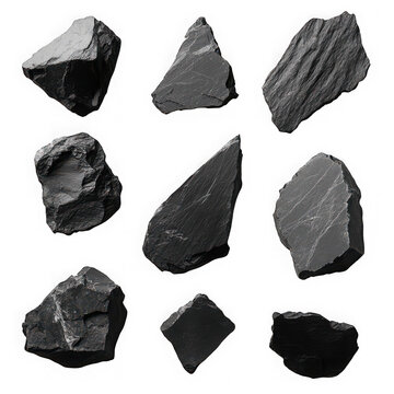 Collection of various slate stone pieces isolated on a black background