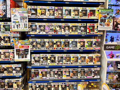 Alicante, Spain - May 16, 2025: Collection of Funko Pop vinyl figures displayed on shelves in a retail store, showcasing various characters and vibrant packaging for collectors