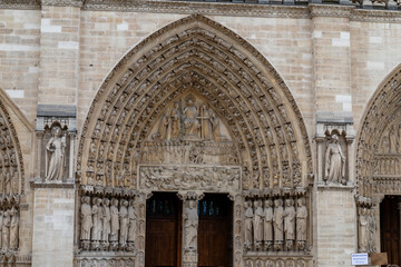 Paris, France-April 16, 2025: Sculpted Portal of Notre-Dame Cathedral
