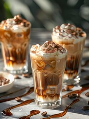 Iced Coffee Delight - Three glasses of iced coffee with whipped cream and chocolate drizzle, perfect for a summer treat