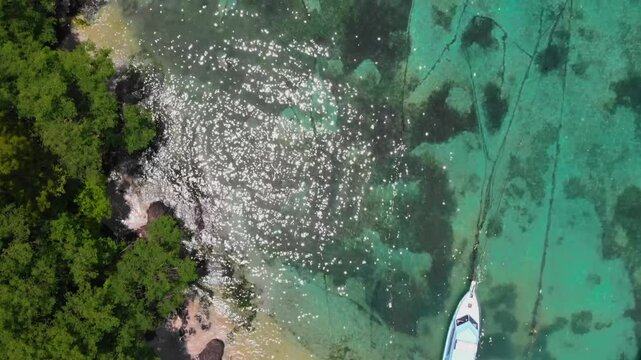 Cinematic drone view of Padangbai, Bali, Indonesia &ndash; a scenic port village and key ferry connection to Lombok and the nearby Lesser Sunda Islands.