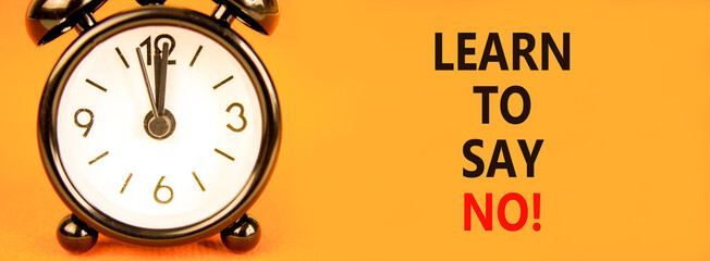 Learn to say no symbol. Concept words phrase Learn to say no on beautiful orange paper. Black alarm...