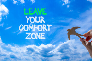 Leave your comfort zone symbol. Concept words Leave your comfort zone on beautiful blue sky. Beautiful blue sky clouds background. Business psychological Leave your comfort zone concept. Copy space.