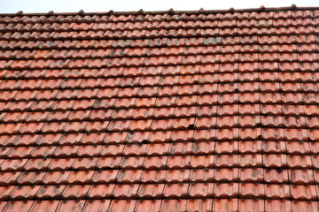 The roof of the house is covered with old red tiles