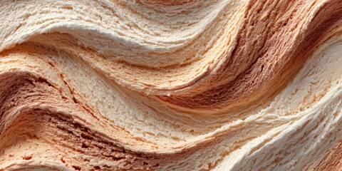 Swirled creamy dessert with soft waves of chocolate and vanilla flavors on textured surface