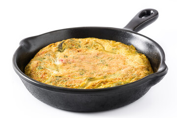 Omelette cooking in cast iron pan on white background