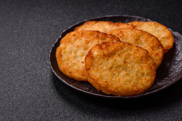 Potato hash browns, a meal with onions, cabbage in the form of fritters