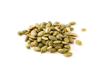 Pumpkin seeds forming a small pile on a white background