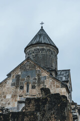 Fototapeta premium ancient stone medieval middle age church of the holy cross in the mountains armenia religion