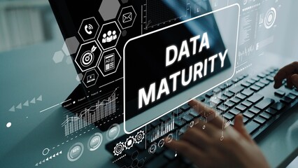Fototapeta na wymiar Data Maturity Concept with Digital Interface and Charts in Modern Office Environment. Asymptotic smart data analytic.