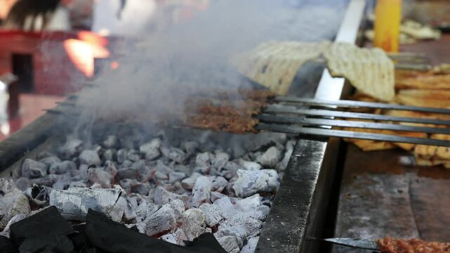 adana kebaps grilling in barbecue
