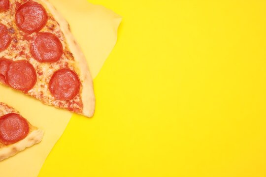Pepperoni pizza slices vibrant yellow backdrop