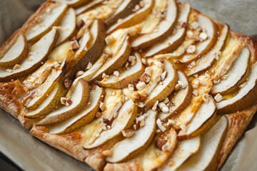 Puff pastry pie with camembert, pear slices, honey and nuts.